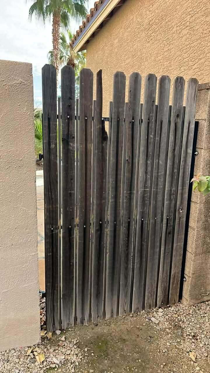Gate with worn slats before refurbishment